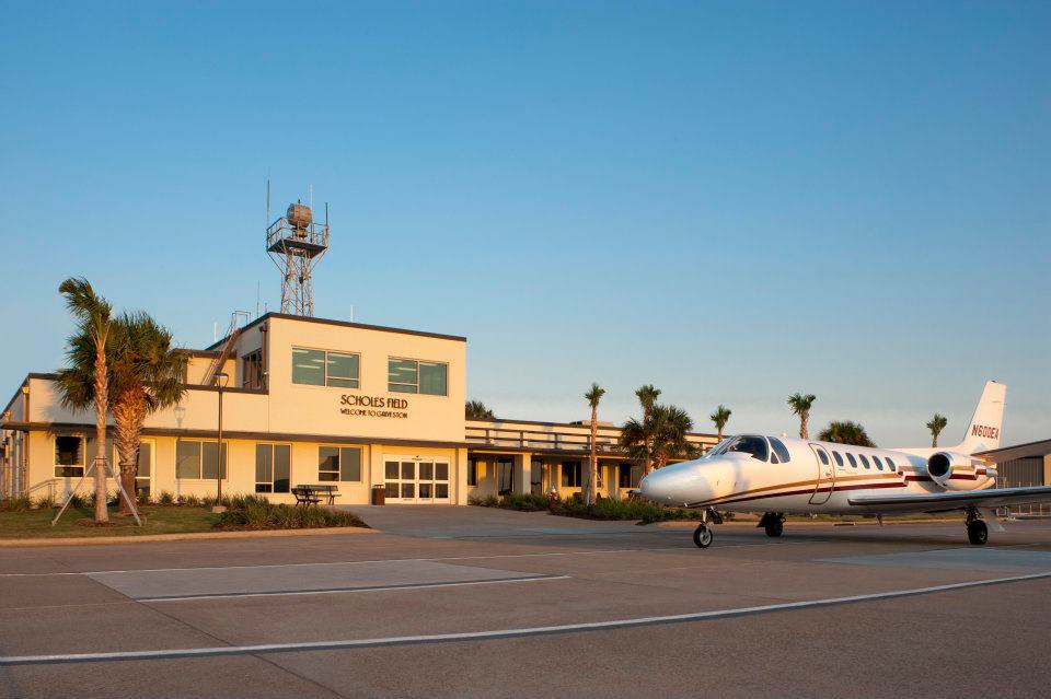 Scholes Airport with Small Airplane in Front